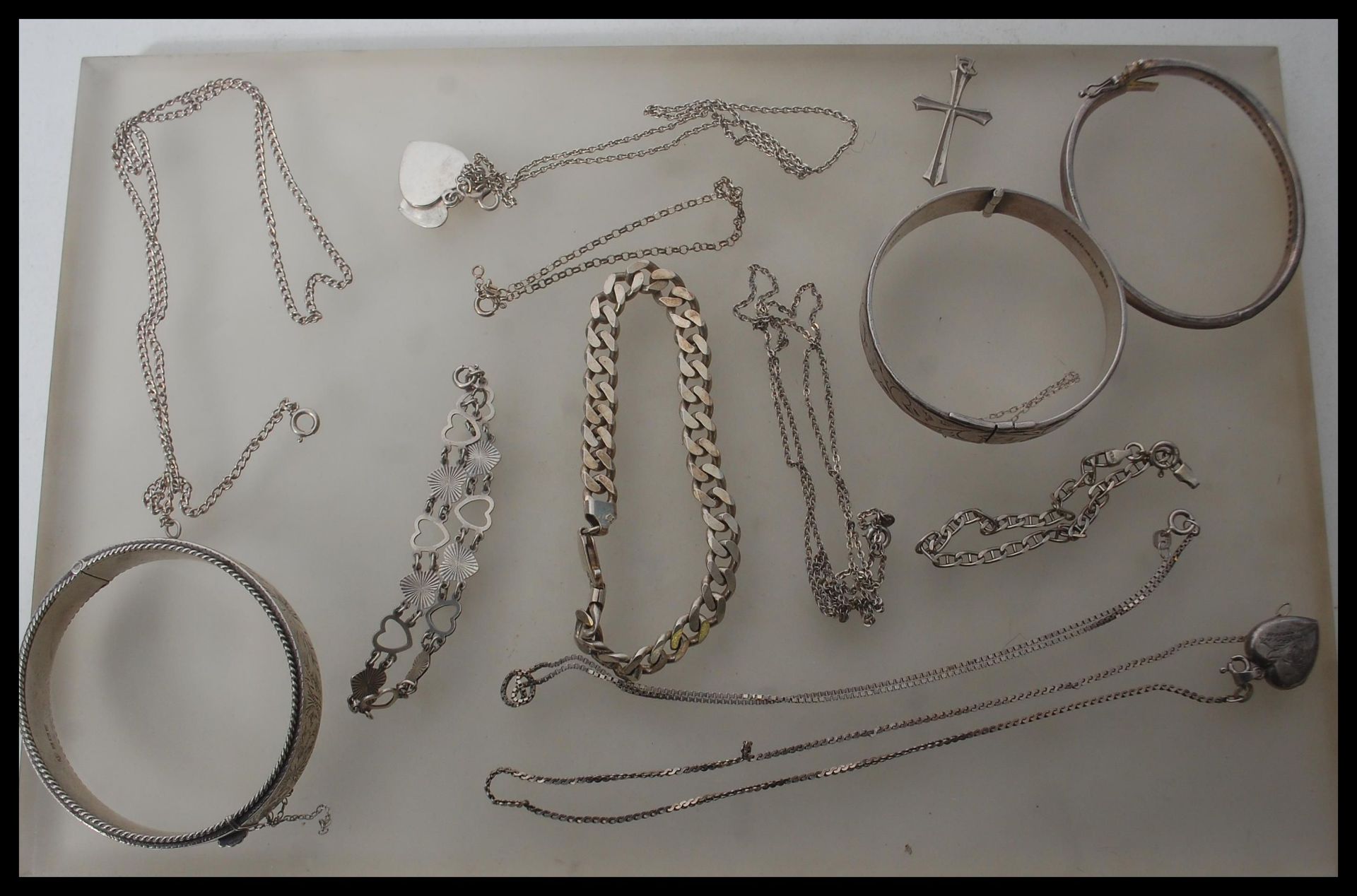 A collection of silver jewellery to include various silver necklaces, silver bangles, silver - Image 3 of 14