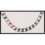 A stamped 925 silver flat link necklace chain having a lobster clasp. Weight 61.6g. Measures 22