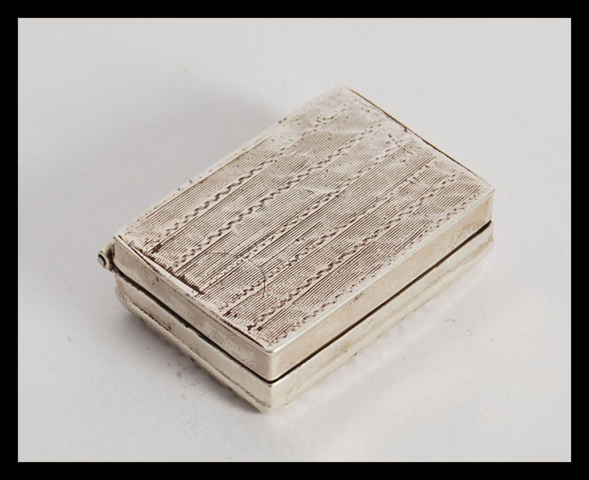 An unmarked silver tests as silver vinaigrette of rectangular form having hinged lid revealing - Image 3 of 4