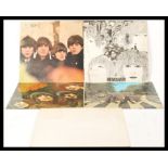 A collection of long play LP vinyl records pertaining to The Beatles to include The White Album #