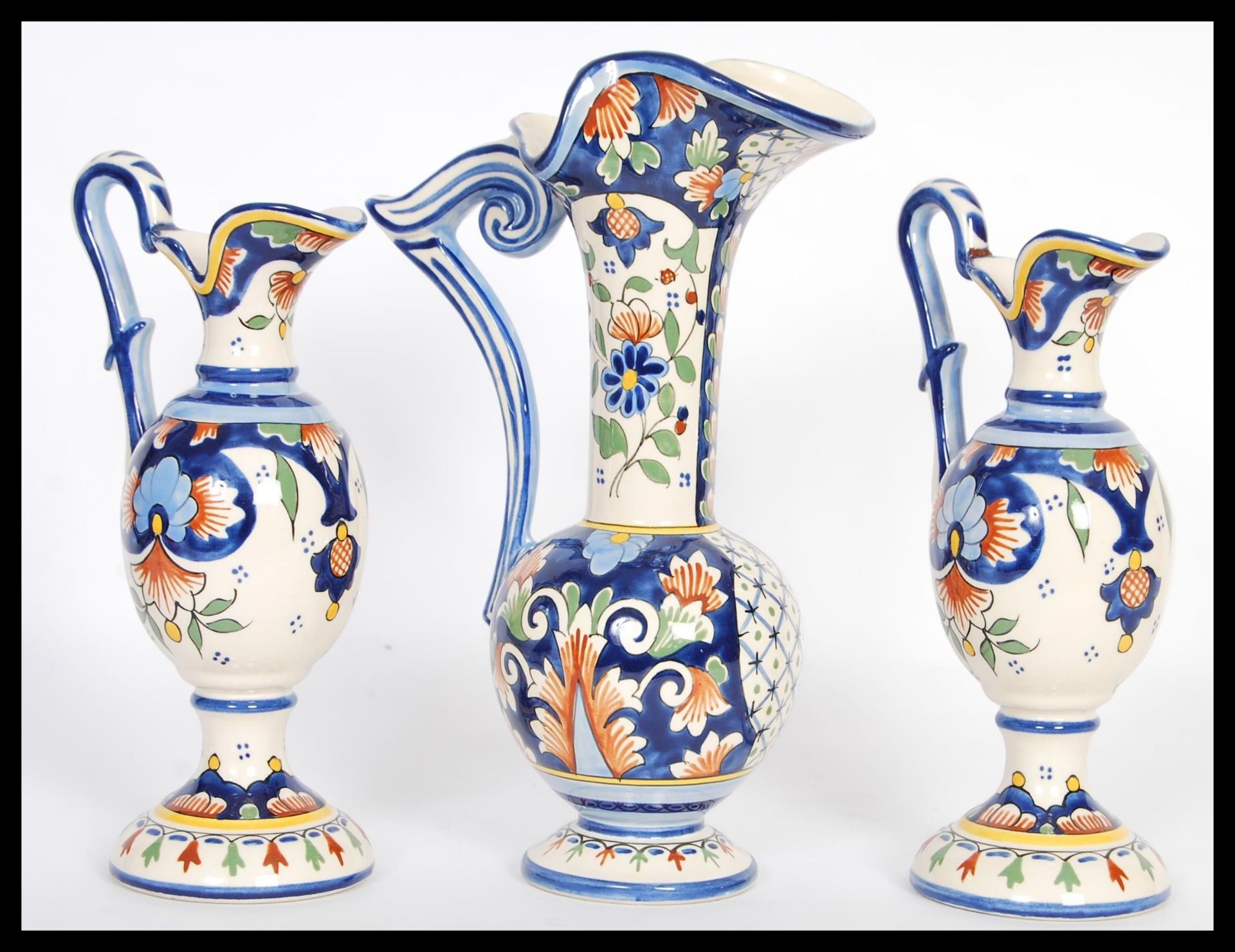 A set of three 20th Century Faience graduating baluster jugs raised on circular bases with bulbous - Image 3 of 5