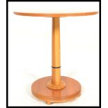 A vintage retro 20th Century John Tanus round dining table, having a round teak wood top and base