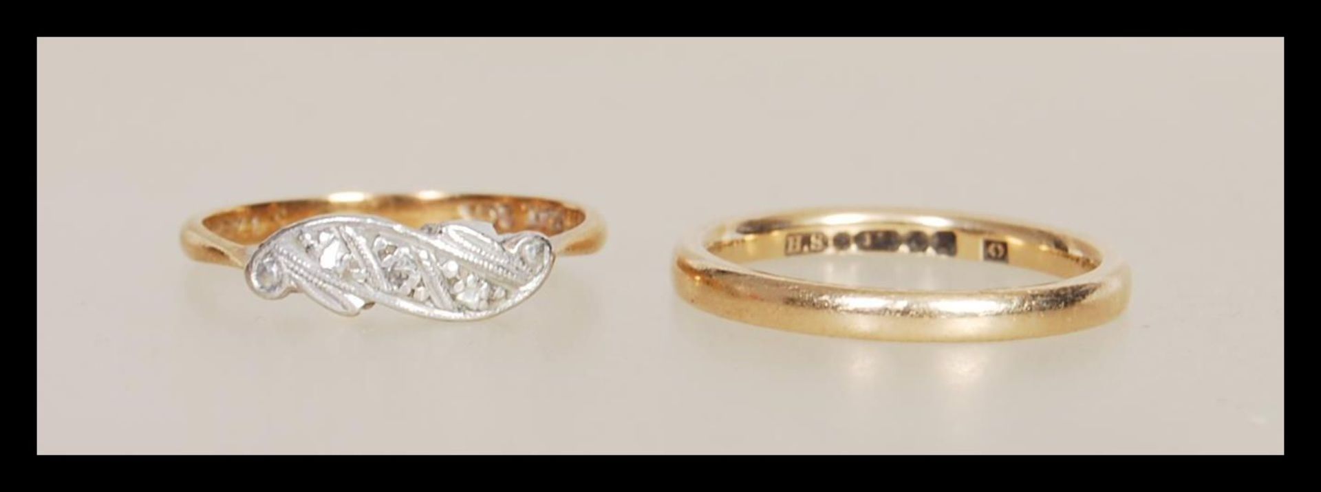 A hallmarked 9ct gold band ring together (hallmarked Birmingham 1972, size M) with a 1930's Art Deco