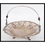 A stamped Silver bon bon dish bowl raised on three feet with pierced decoration and twisted handle