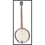 A vintage retro 20th Century Weatherking Remo 5 string banjo musical instrument. Measures 93cm