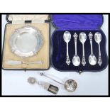 A group of silver and silverplate to include a cased set of five hallmarked tea spoons, hallmarked