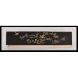 A Japanese brooch having a rectangular panel with decorated gilt birds on bamboo in a gold casing,