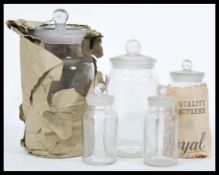 A collection of five vintage storage / sweet jars and stoppers of graduating sizes, the largest