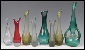 A collection of mostly Whitefriars vintage studio art glass beak vases to include ruby red