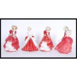 A collection of four Royal Doulton ceramic figurines to include ' The Ermine Coat ' 842488, two '