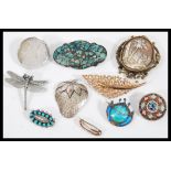 A collection of vintage 20th Century brooches to include a micro mosaic, cameo carved,silver, silver