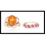 Two 9ct gold rings to include a hallmarked Art Nouveau style ring set with an orange stone