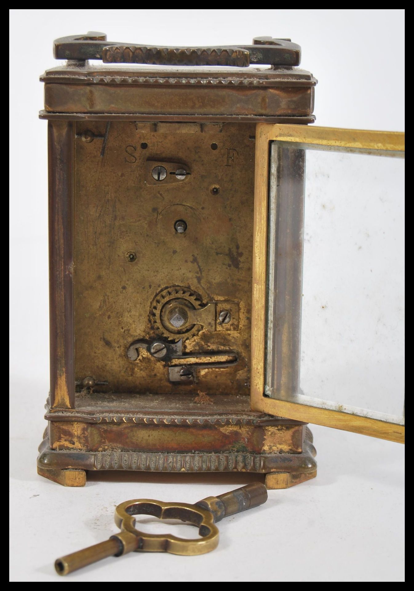 A 19th Century French brass carriage clock having a Roman numeral chapter ring with swing handle - Image 5 of 5