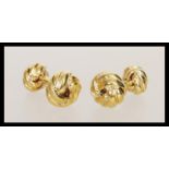 A pair of 18ct gold plated cufflinks having knot design heads. Measures 2cm wide.