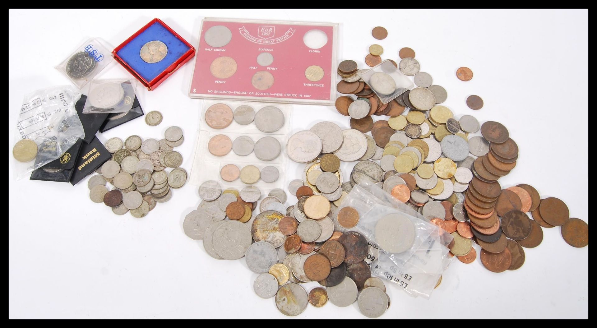 A collection of all world coins including pre-decimal silver sixpences, various American US coins