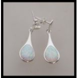 A pair of stamped 925 silver earrings set with opal panel drops. Stud backed. Weight 4.2g. Drops