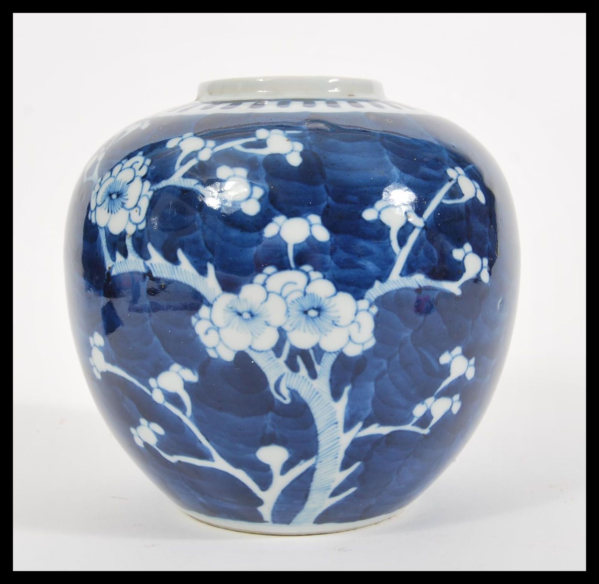 A 19th Century Chinese blue and white ginger jar and cover hand decorated in the prunus pattern.