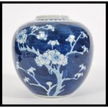 A 19th Century Chinese blue and white ginger jar and cover hand decorated in the prunus pattern.