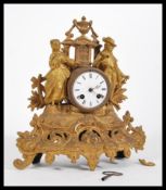 A late 19th Century Victorian French ormolu Boudoir Clock, in the rococo style with enamel dial