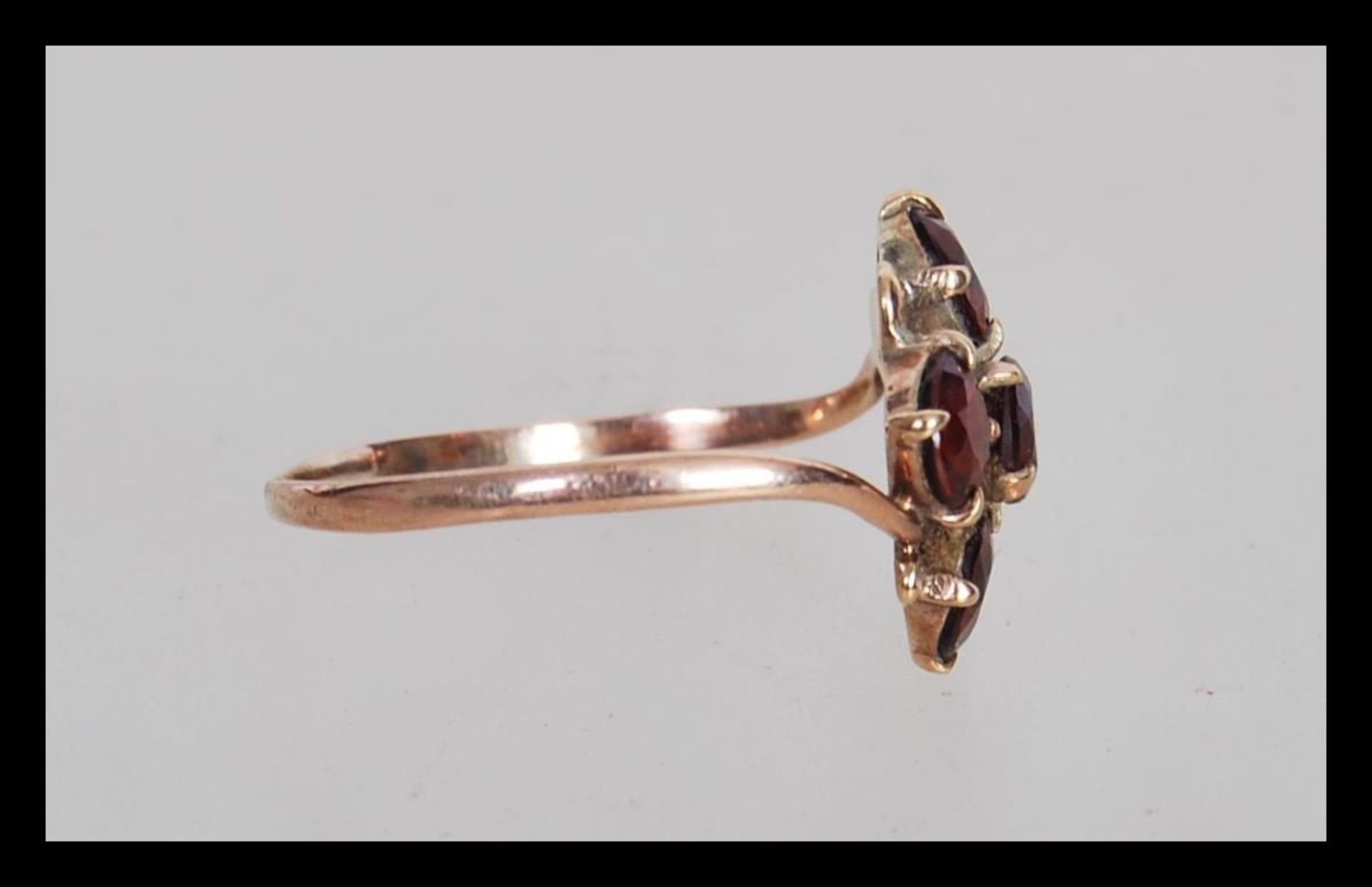 A 9ct gold 19th Century Victorian cluster ring prong set with five round cut garnet's. Ring unmarked - Image 2 of 3