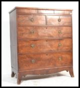A 19th century George III mahogany two part chest of drawers being raised on French kick legs having