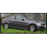 A 3 series 318i BMW five door saloon car. WN57 YGH