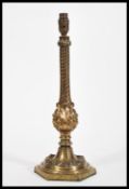 A large and heavy 19th Century Victorian bronze table lamp raised on hexagonal base with leaf and
