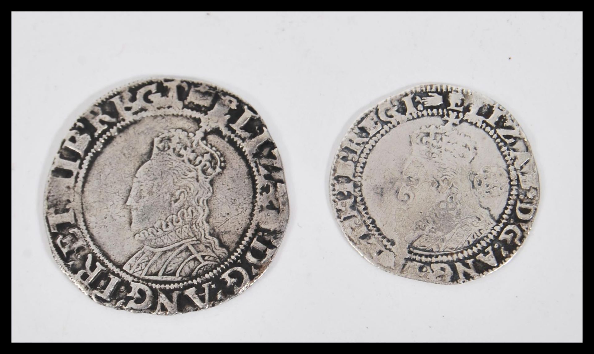 Two Elizabethan 16th Century hammered silver coins to include a 1590 sixpence having the head facing