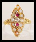 A 9ct gold seed pearl, ruby and diamond ring in lo