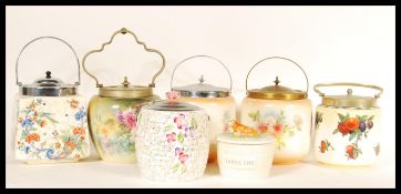 A collection of ceramic biscuit barrels dating fro