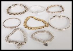 A good group of sterling silver bracelets to inclu