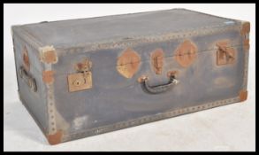 A vintage 20th century steamer trunk, hinged lid s