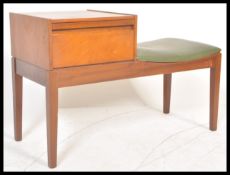 A retro 1970's teak wood telephone table / seat by