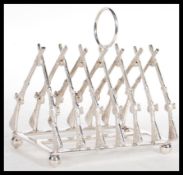 A silver plated toast rack of hunting interest wit