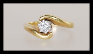 An unmarked but tests as 18ct gold and diamond hav