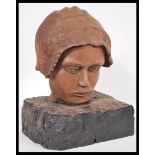 A 19th Century carved wooden bust head of a child