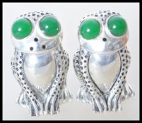 A pair of stamped 800 silver salt and pepper condi