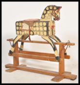 A mid 20th Century childs rocking horse, the rocki