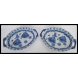 A pair of blue and white twin handled trays, the t