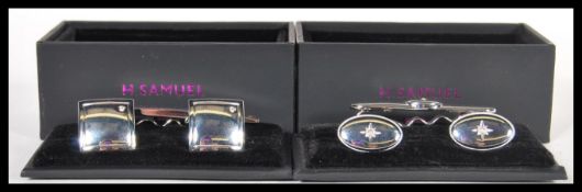 Two sets of white metal gentleman's cufflinks and