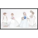 A collection of three ceramic Nao figurines to inc