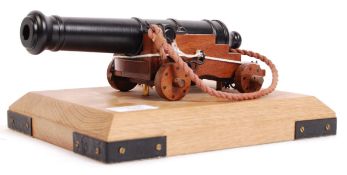 CONTEMPORARY CAST METAL AND WOODEN DESKTOP CANNON