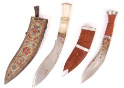 TWO 20TH CENTURY KUKRI KNIVES AND SCABBARDS