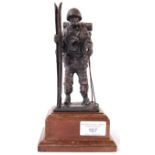 BRONZE 20TH CENTURY MILITARY FIGURE OF A SOLDIER WITH SKIS