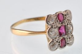 An Art Deco ruby and diamond shaped rectangular cluster ring being set with 3 rubies and 6 old cut