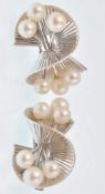 A pair of Art Deco white gold and pearl earrings.