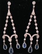 A pair of platinum Belle Époque diamond and aquamarine chandelier earrings. The earrings having dual