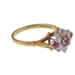 AN 18CT GOLD LADIES RUBY AND DIAMOND CLUSTER RING