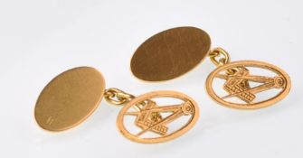 A pair of 18ct gold gentleman's cufflinks having masonic oval design united by chains. One side