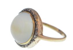 A 19th century gold diamond and quartz ring. The ring being set with a large parti coloured quartz